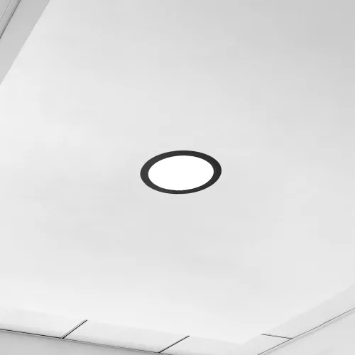 Fekete, kerek Avide Extra Ring alumínium dekorgyűrű egy 18w-os beépített fehér LED panellel, mennyezeten