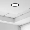 Fekete, kerek Avide Extra Ring alumínium dekorgyűrű egy 24w-os beépített fehér LED panellel, mennyezeten